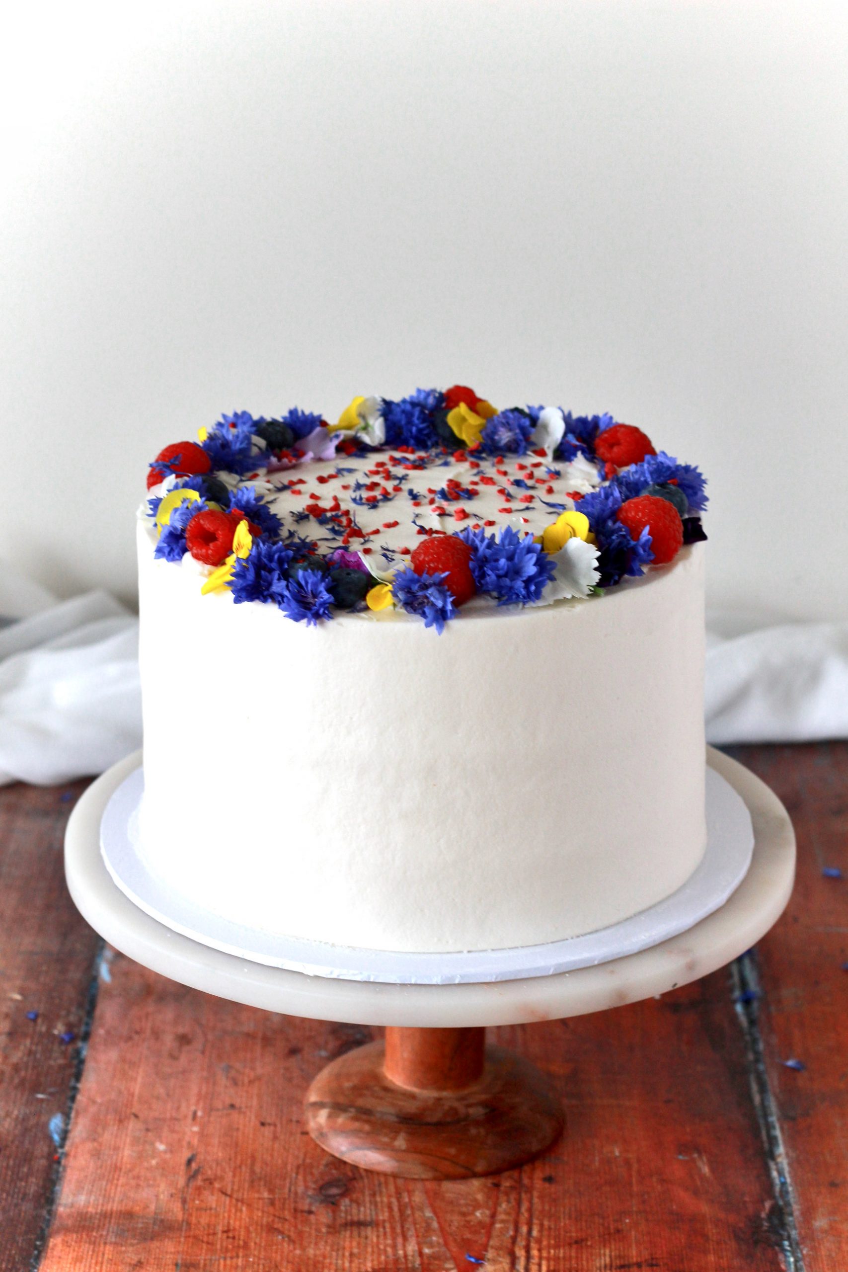 Date and salted caramel cake with fresh fruit and flowers